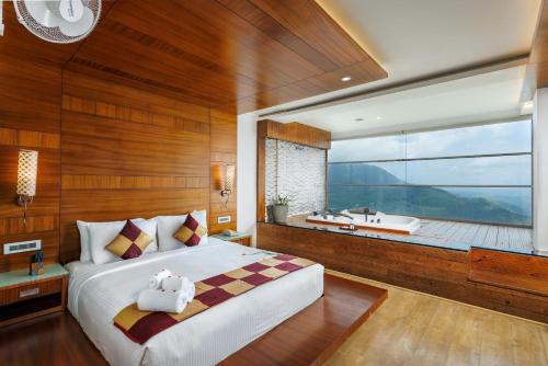 Postel nebo postele na pokoji v ubytování Amber Dale Luxury Hotel & Spa, Munnar