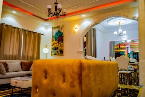 a living room with a couch and a table at Prince Home in Douala