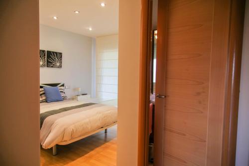 Ένα ή περισσότερα κρεβάτια σε δωμάτιο στο El Bon Pas Rural