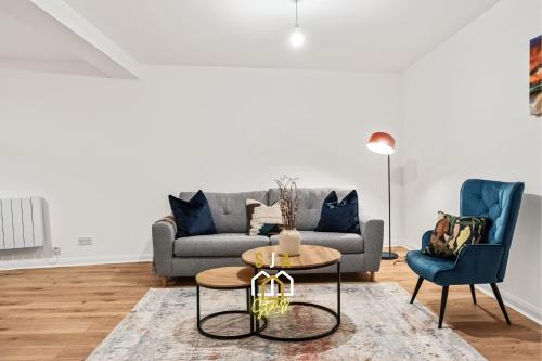 a living room with a couch and two chairs at Lochy Stay - SJA Stays - Modern 2 Bed Apartment in Aberdeen