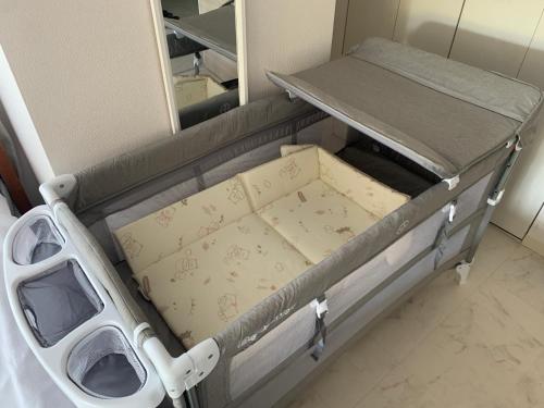 a hospital bed with a mirror in a room at O2 capsule house OTARU in Otaru
