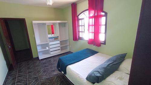 Ένα ή περισσότερα κρεβάτια σε δωμάτιο στο Pousada casa nostra