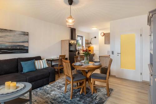 a living room with a couch and a table at Marla in Lauterbach
