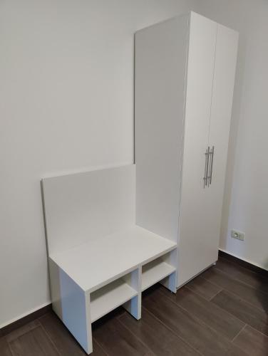 a room with white cabinets and a desk at Casa Catalina Obligado in Obligado