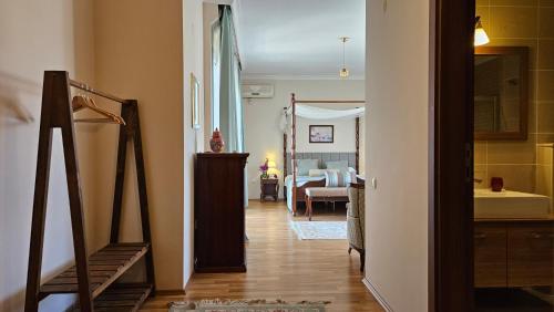 a hallway leading to a room with a bedroom at Ephesus Suites in Selcuk
