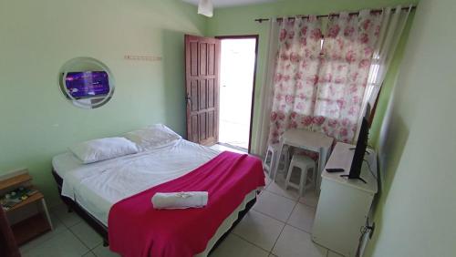Ένα ή περισσότερα κρεβάτια σε δωμάτιο στο Pousada casa nostra