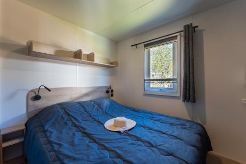 Katil atau katil-katil dalam bilik di CAMPING LES OURMES