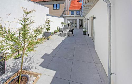 a patio with a table and chairs on a house at Reihenhaus Plau Am See in Plau am See