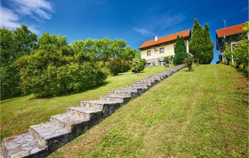 a stone retaining wall in front of a house at 2 Bedroom Nice Home In Donja Stubica in Donja Stubica