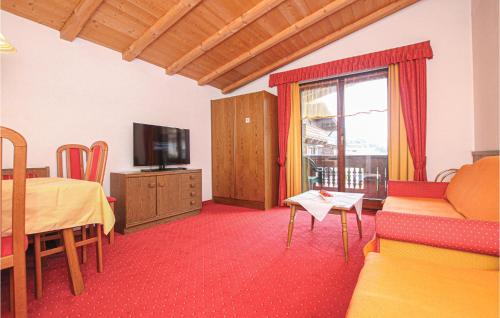 Televízia a/alebo spoločenská miestnosť v ubytovaní Ferienwohnung - Kirchberg