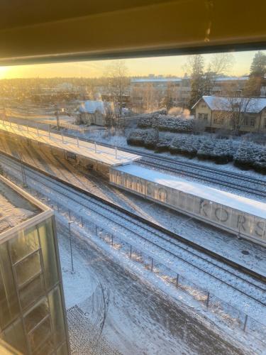 a view of a train station with snow on the tracks at Jeffrey in Vantaa