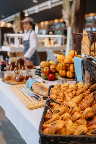 a table with pastries and other food on it at Sezz Saint-Tropez in Saint-Tropez