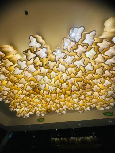 a art installation of rice on the ceiling of a room at Mactan Newtown Cebu Affordable Suite! in Mactan