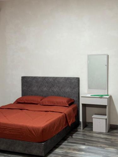 Postel nebo postele na pokoji v ubytování Wong Homestay