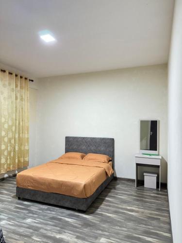 Postel nebo postele na pokoji v ubytování Wong Homestay