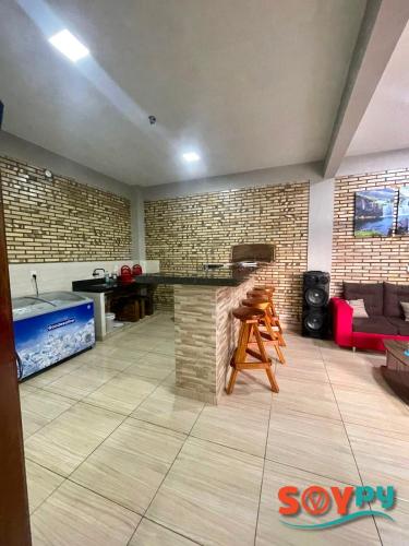 a living room with a stone counter and a couch at Sublime y moderno alojamiento in Barrio San Isidro (2)