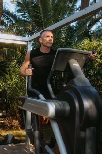 a man on a treadmill in a gym at Sezz Saint-Tropez in Saint-Tropez