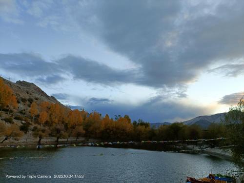 a view of a river with trees in the background at Lakeside Nako Hotel & Restaurant in Nako