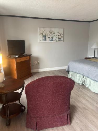 Una cama o camas en una habitación de ANS INN & SUITES