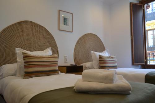 Postel nebo postele na pokoji v ubytování Sunshine San Fernando