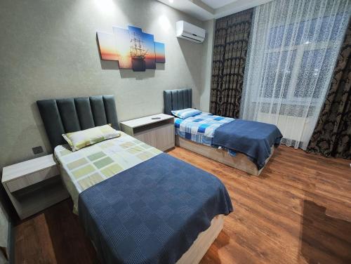 Postel nebo postele na pokoji v ubytování Gemi Hotel