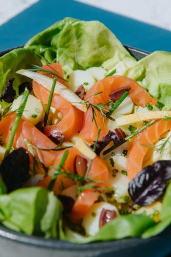 a salad with tomatoes and cheese on a plate at Sezz Saint-Tropez in Saint-Tropez