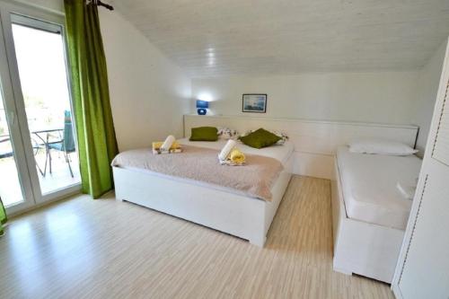 Posteľ alebo postele v izbe v ubytovaní Apartment Denko