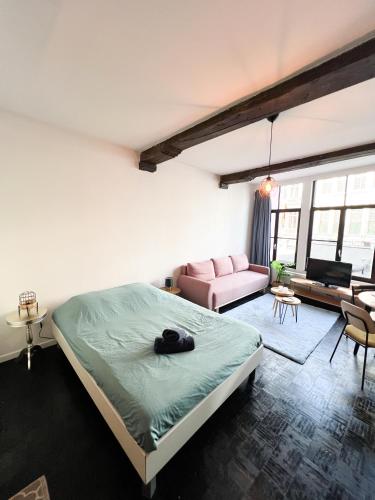 Postel nebo postele na pokoji v ubytování Rustieke studio in hartje antwerpen