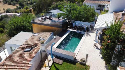 an aerial view of a house with a swimming pool at Cozy house in São Brás de Alportel with shared pool 60 m² in São Brás de Alportel