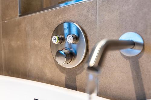 a bathroom sink with a chrome faucet at Parkhotel Horst - Venlo in Horst