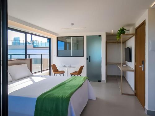 Una cama o camas en una habitación de Restinga by Xtay - Studios com piscina e academia, pé na areia em João Pessoa
