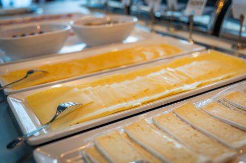 a bunch of food in trays on a table at Parkhotel Horst - Venlo in Horst