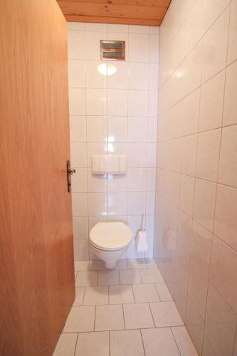 a bathroom with a toilet in a room at Apartment Voithofer-1 by Interhome in Königsleiten