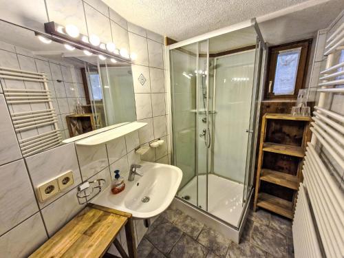 a bathroom with a sink and a shower at Holiday Home Hackenschmiede by Interhome in Prutz