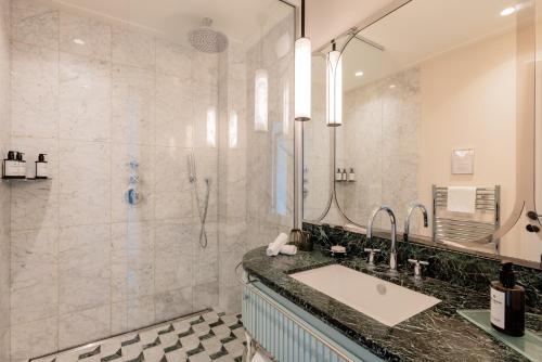 a bathroom with a sink and a shower at Mondrian Cannes in Cannes