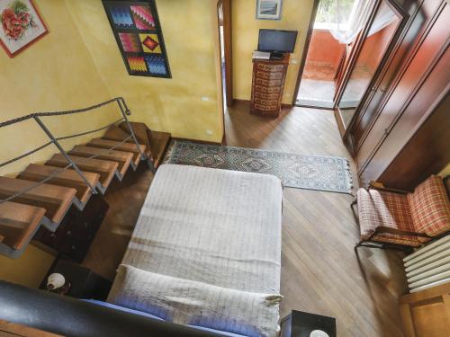 an overhead view of a living room with a couch and stairs at Holiday Home Desideri by Interhome in Fornello