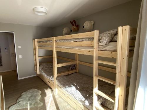 a room with two bunk beds with stuffed animals at Apartment Alpenrose by Interhome in Adelboden