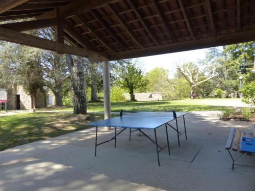 a blue ping pong table under a pavilion with a park at Apartment Les Vans-Cottage 3 pièces 6 personnes by Interhome in Chambonas
