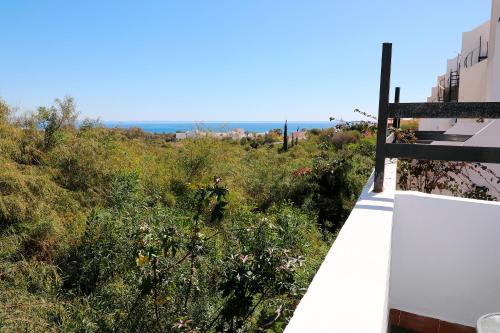 a view of the ocean from a balcony of a building at Luna de Mojácar in Mojácar