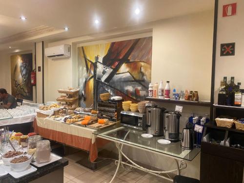 a buffet line with food in a restaurant at Hotel La Aldea Suites in La Aldea de San Nicolas
