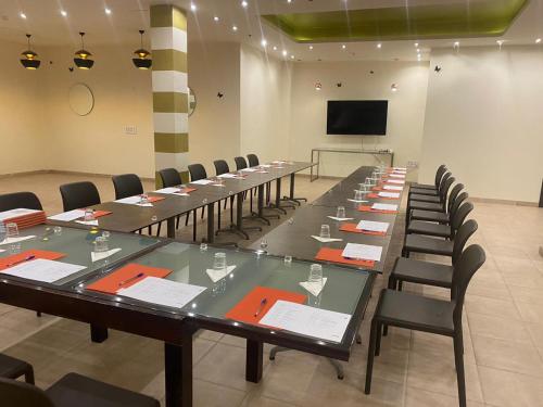 a large conference room with a long table and chairs at Hotel La Aldea Suites in La Aldea de San Nicolas