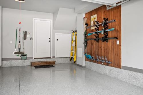 a room with a wooden wall with wine racks at Snowbasin Chalet in Morgan