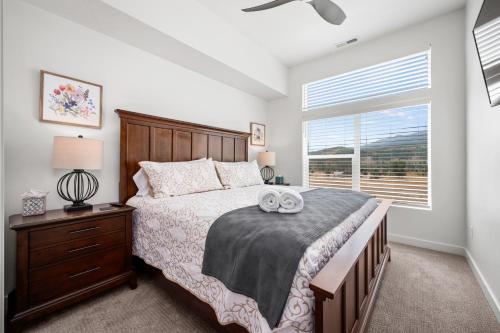 a bedroom with a large bed and a window at Snowbasin Chalet in Morgan