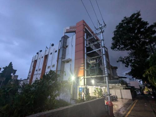 a tall building with a sign on the side of it at Hotel Shivneri in Bilāspur