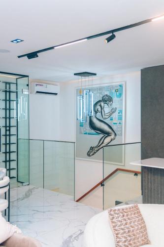 a room with a glass partition with a picture on the wall at Wakatee Apartments - Luxury 2 bedrooms Apartment in Victoria Island