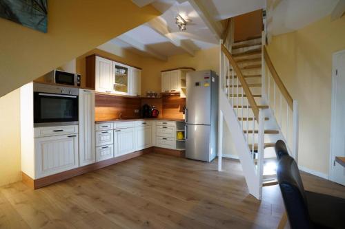 Fotografie z fotogalerie ubytování Maisonette Seebrise Mit Seeblick Am Strand v destinaci Flessenow