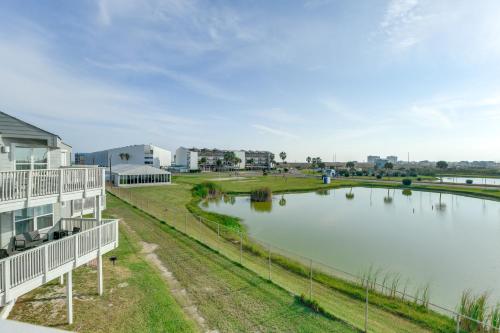 an aerial view of a lake in front of a building at Balcony, Pool and Beach Access Port Aransas Condo! in Mustang Beach