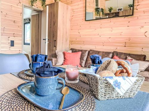 a table with a tray of food on top of it at Holiday Home Tiny Haus Glockenalm-Haus 4-Jahreszeiten by Interhome in Aurach
