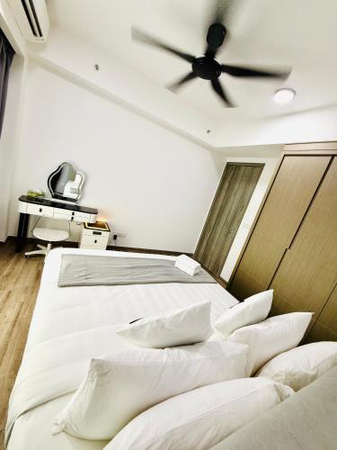 a bedroom with two beds and a ceiling fan at Agile TRX Luxury suite Bukit bintang in Kuala Lumpur