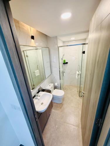 a bathroom with a sink and a toilet and a shower at Agile TRX Luxury suite Bukit bintang in Kuala Lumpur
